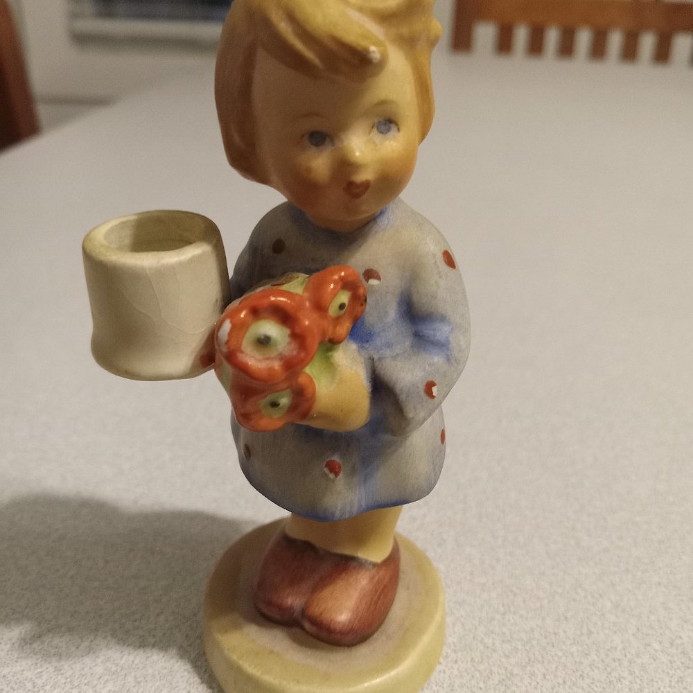 hummel girl with flowers and candle holder in new condition  item not available)